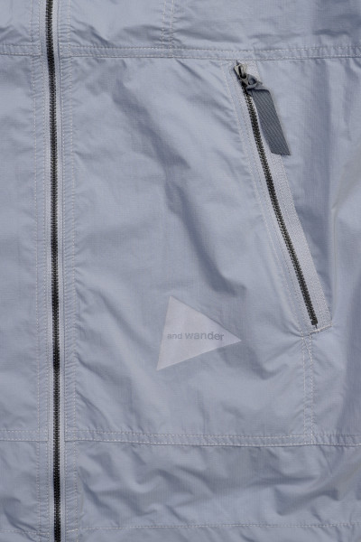 And wander Pertex wind jacket Light blue - GRADUATE STORE